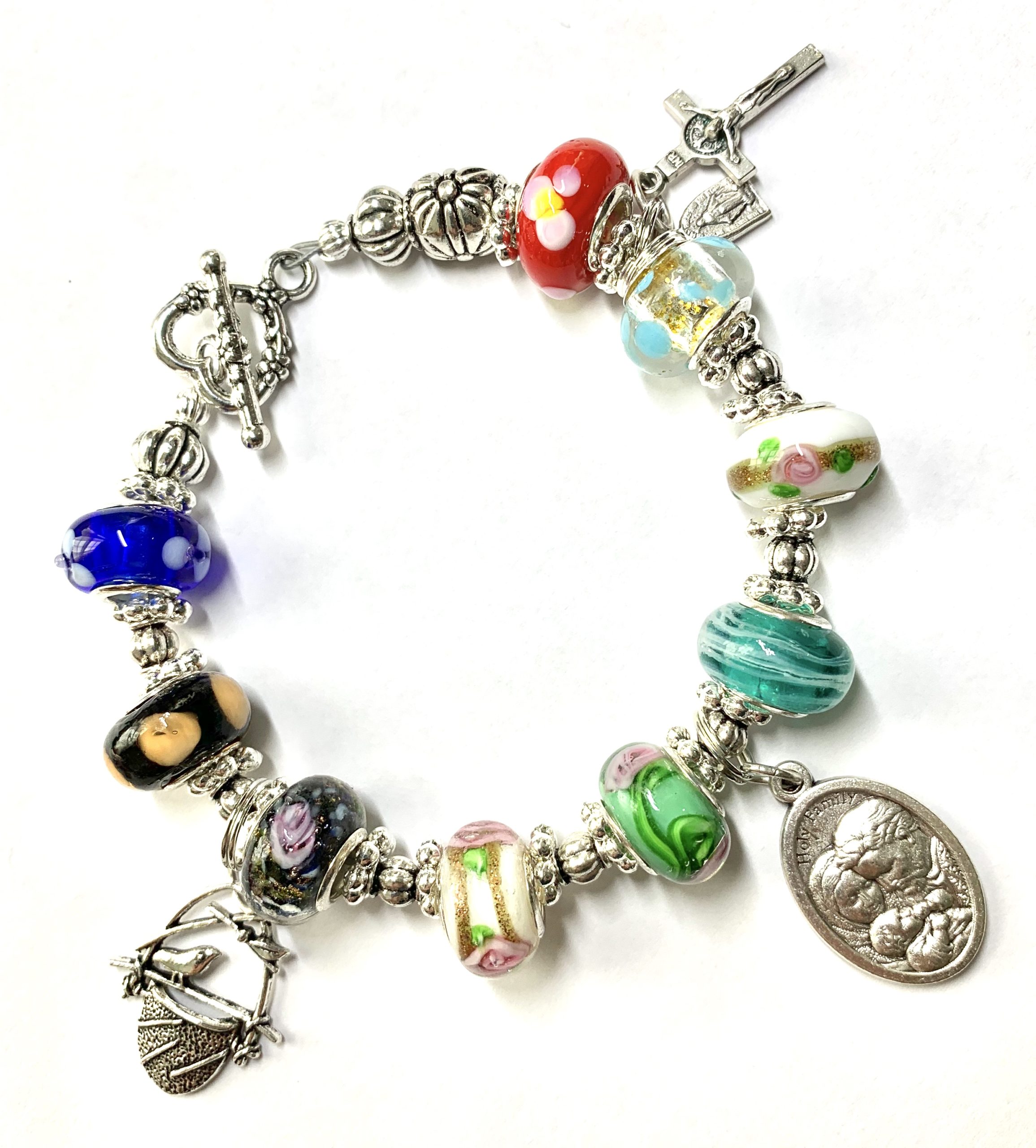 STERLING SILVER AND ART GLASS CHARM BRACELET